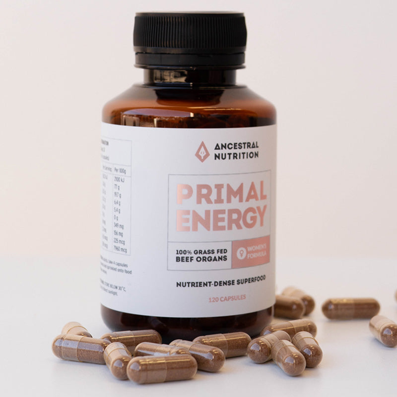Bottle of Ancestral Nutrition Primal Energy supplement with capsules on a light background