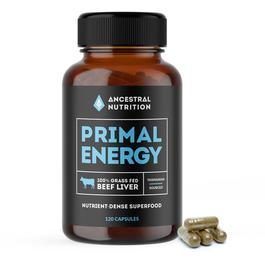 A box of Primal Energy grass-fed beef liver capsules by Ancestral Nutrition, with a bottle of the capsules in front of the box.